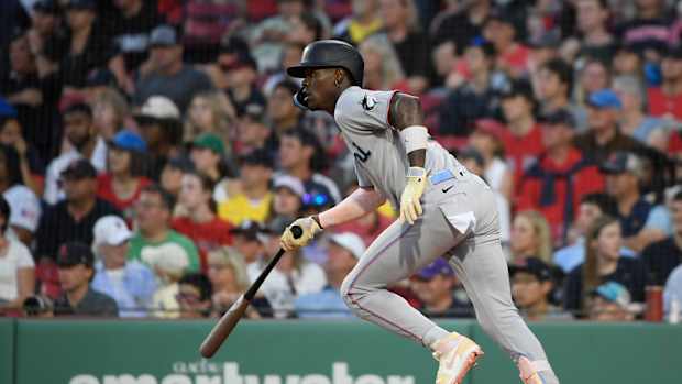 Miami Marlins center fielder Jazz Chisholm hits a single against the Boston Red Sox.